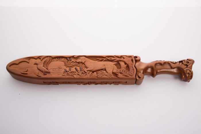 Custom made and carved knife handle and sheath (one side view)