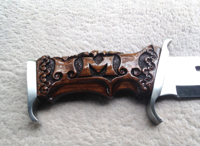 Custom made and carved knife handle with owner's initials